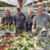 Family in Spring Greenhouse